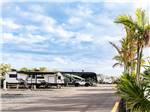 A row of RVs parked in gravel sites at SUN OUTDOORS SUGARLOAF KEY - thumbnail
