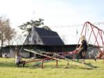 Children playing on the seesaw at THE OUACHITA RV PARK - thumbnail