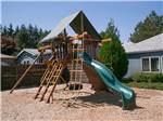 Wood playground structure at SUN OUTDOORS PORTLAND SOUTH - thumbnail