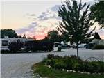 RVs parked outside at dusk at LAZY DAY CAMPGROUND - thumbnail