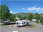 Trailers camping with low hills in the background at DAKOTA RIDGE RV RESORT - thumbnail