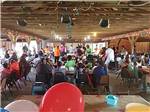 A group of people eating under the pavilion at TOWN & COUNTRY CAMP RESORT - thumbnail