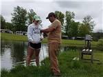 A father and daughter fishing at TOWN & COUNTRY CAMP RESORT - thumbnail