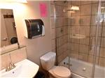 Well-appointed bathroom with tile and shower at NORTHERN LIGHTS RV PARK - thumbnail