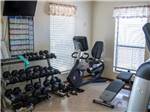 Weight room with exercise bike at TOWN & COUNTRY RV PARK - thumbnail