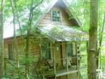 Wooden cabin at WHISPERING PINES CAMPGROUND & RV PARK - thumbnail