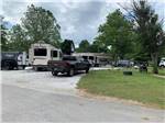View larger image of RVs parked near trees at BIG RED BARN RV PARK image #3