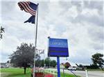 The front entrance sign with a flag at SHIPSHEWANA CAMPGROUND SOUTH PARK - thumbnail