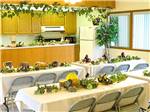Tables decorated with leaves and food at OLDE STONE RV RESORT - thumbnail