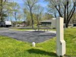 Paved site with picnic table at FOOTHILLS RV PARK & CABINS - thumbnail
