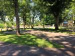Paved site shaded by trees at FOOTHILLS RV PARK & CABINS - thumbnail