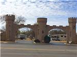 View larger image of The front entrance gates at CAMELOT VILLAGE RV PARK image #1
