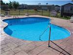 View larger image of The swimming pool area at CAMELOT VILLAGE RV PARK image #2