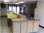 View larger image of Inside of the kitchen area at CAMELOT VILLAGE RV PARK image #3