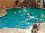 Kids swimming in the pool at SAUDER VILLAGE CAMPGROUND - thumbnail