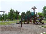 Playground with swing set at SAUDER VILLAGE CAMPGROUND - thumbnail