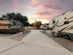 Open RV space next to parked RV at Allstar RV Resort - thumbnail