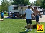 View larger image of A group of people playing cornhole at MILTON KOA image #9
