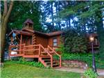 Rental cabin from the side at Shipshewana Campground North Park & Amish Log Cabin Lodging - thumbnail