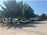 RVs and a truck in sites at Shipshewana Campground North Park & Amish Log Cabin Lodging - thumbnail