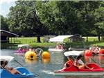 People riding in paddle boats at BAYLOR BEACH PARK WATER PARK & CAMPGROUND - thumbnail