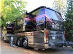 A bus conversion in a RV site at YOSEMITE PINES RV RESORT AND FAMILY LODGING - thumbnail
