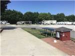 View larger image of Concrete site with picnic table and patio at OWL CREEK MARKET  RV PARK image #11