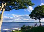 The ocean, trees and blue sky - thumbnail