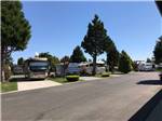 A row of paved, pull thru RV sites at MIDWAY RV PARK - thumbnail