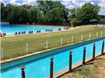 Lazy River and pool with lounge chairs at Auburn RV Park and Resort Pools - thumbnail