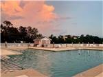 The swimming pool at dusk at GULF BREEZE RV RESORT - thumbnail