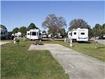 A row of trailers parked in RV sites at GULF BREEZE RV RESORT - thumbnail