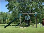 View larger image of The playground equipment at QUILLYS MAGNOLIA RV PARK image #4