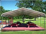 View larger image of The pavilion with picnic benches at QUILLYS MAGNOLIA RV PARK image #6