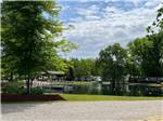 The swimming lake with a dock at BLUEGRASS CAMPGROUND - thumbnail
