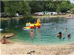 Families swimming in the lake at BLUEGRASS CAMPGROUND - thumbnail