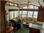 The living room in one of the rental cabins at BLUEGRASS CAMPGROUND - thumbnail