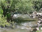 View larger image of The fast running stream nearby at WHISTLER GULCH CAMPGROUND  RV PARK image #7
