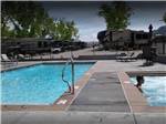 View larger image of The pool and hot tub area at SPANISH TRAIL RV PARK image #2