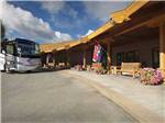 View larger image of Office with flag and benches in front at THE VILLAGES AT TURNING STONE RV PARK image #4