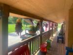 Colorful tables and seats on the deck at DEER SPRINGS RV RESORT - thumbnail