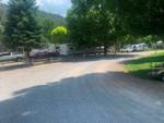 The rounded, gravel road near the sites at DEER SPRINGS RV RESORT - thumbnail