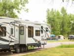 RV parked and tents in background at ON THE RIVER GOLF & RV RESORT - thumbnail
