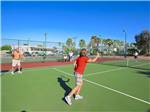 Couples playing tennis at SUN LIFE RV RESORT - thumbnail