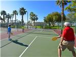 Couples playing pickleball during the day at SUN LIFE RV RESORT - thumbnail