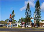 Couples playing pickleball at ENCORE PIONEER VILLAGE - thumbnail