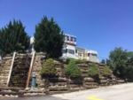 View of rock and wooden retaining wall at BEACON RV PARK - thumbnail