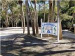 View larger image of The entrance sign by the trees at IMPERIAL BONITA ESTATES RV RESORT image #11