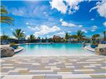 The pool under vibrant blue skies - thumbnail