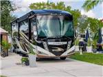 A large motorhome in a paved site - thumbnail